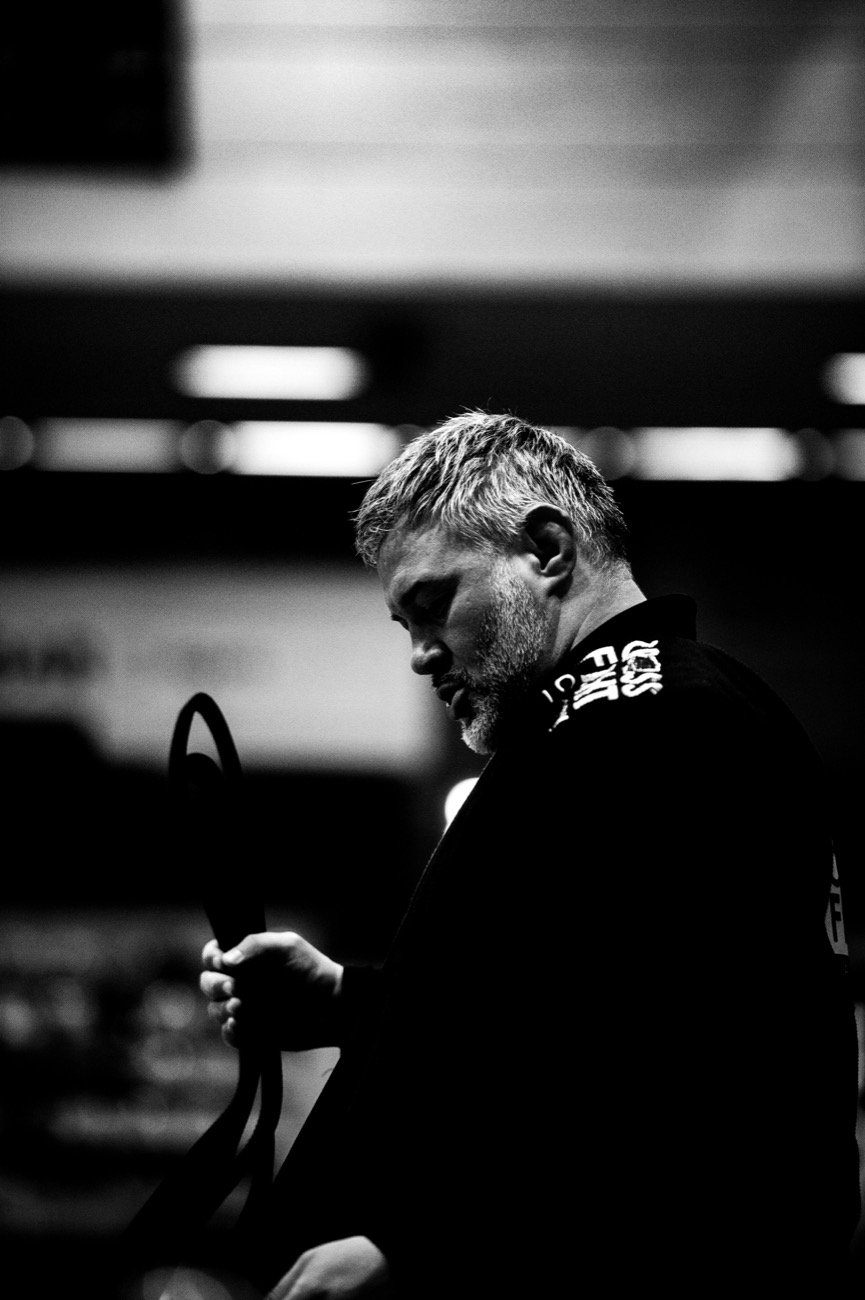 Bruno Ivan Tomasetti in a black gi, holding his belt